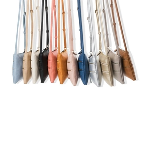 Detailed display of multi-color crossbody phone bags with zippers and adjustable straps