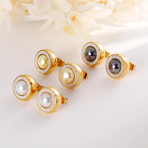 Elegant jewelry set with three pairs of gold-plated pearl stud earrings with crystal accents