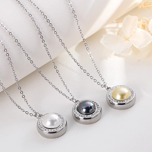 Three-piece stainless steel pearl pendant necklace set with crystal halo on silver chains