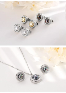 Detail of silver stainless steel jewelry set featuring pearl and diamond halo accents