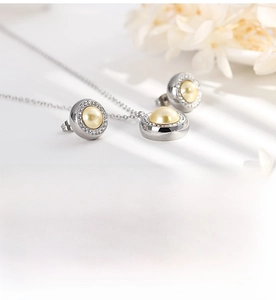 Detailed view of rust-resistant stainless steel pearl necklace and diamond earrings set