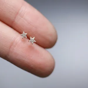 Minimalist 925 sterling silver star stud earrings with 14K gold plating and sparkling zircons
