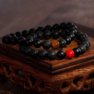 Retro 8mm lava rock and matte black bead bracelets with tiger eye stone on wood