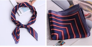 Detail of navy silk satin scarf with red and white stripe edges in a knotted style