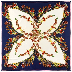 Detail of floral printed satin silk scarf featuring navy blue borders and elegant patterns