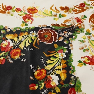 Close-up of butterfly floral print on satin scarf with black and white contrast