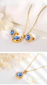 Detail of gold jewelry set featuring deep blue gemstones and micro-pave crystals
