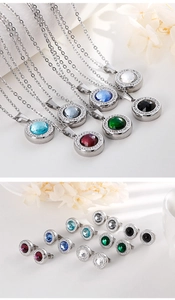 Detail of round crystal stainless steel pendant necklaces and stud earrings set