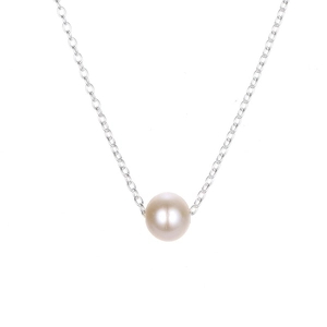 Close-up of a minimalist baroque pearl pendant necklace with a polished silver steel chain
