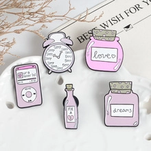 Set of 5 pink enamel pins featuring retro MP3 player, alarm clock and bottles on ceramic dish