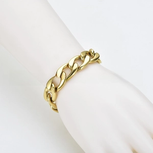 Macro view of heavy gold-tone cuban link chain texture and thick metal structure