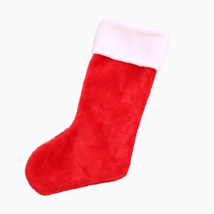 Classic red plush Christmas stocking with white faux fur cuff for holiday gift decoration
