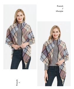 Detail view of purple and blue plaid scarf with fringes and elegant tassels
