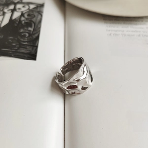 Detailed view of irregular molten lava texture on S925 sterling silver open ring