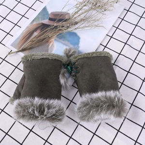 Detailed view of olive green fingerless gloves with faux fur trim and lace-up design