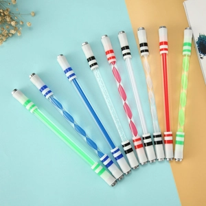 Luminous spinning pens in various colors displayed on a cyan and orange background
