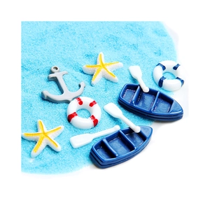 Miniature resin ocean set with blue boats, oars, lifebuoys, anchor and yellow starfish