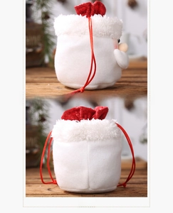 Detail view of the side and back of a Santa themed plush burlap drawstring gift bag
