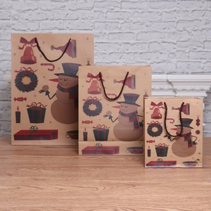 Set of 3 Christmas kraft paper gift bags with holiday patterns and sturdy rope handles