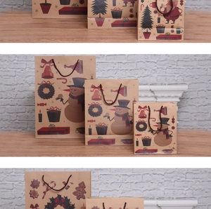Three sizes of Christmas kraft paper gift bags with snowman and Santa Claus designs