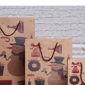 Three assorted sizes of Christmas kraft paper gift bags featuring snowman and wreath prints