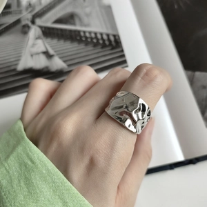 Irregular textured 925 sterling silver wide ring with a molten metal aesthetic design