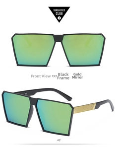 Detail of oversized black sunglasses with gold mesh temples and gold mirror lenses