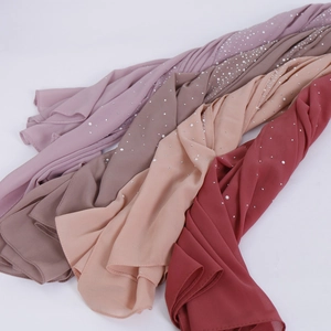 Close-up of lightweight chiffon shawls with elegant pearl beads in multiple colors