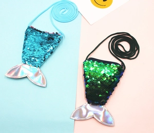 Detailed view of blue and green sequined mermaid tail coin purses with colorful laser fins