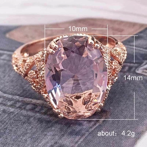 Elegant rose gold engagement ring with 10x14mm oval pink zircon and filigree band