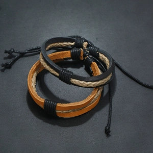 Set of two woven leather bracelets in black and brown with adjustable rope closure
