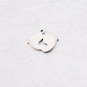 Close-up of baby footprint charm in polished stainless steel for necklace pendant