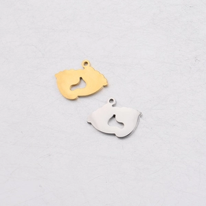 Polished stainless steel baby footprint charms with heart cutout in gold and silver