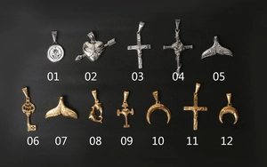 Detailed catalog of 12 vintage steel pendants including cross and whale tail motifs