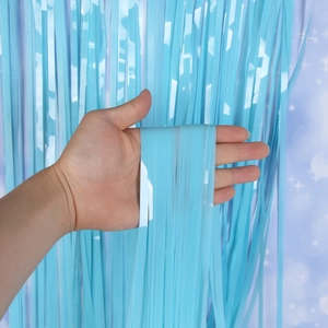 Detailed view of light blue tinsel curtain texture with high gloss and smooth drape