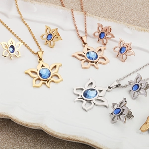 Sunflower necklace and earring jewelry set with blue zircon in gold, rose gold and silver