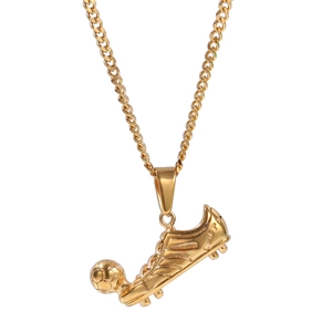 Close-up of golden vacuum plated soccer shoe pendant on a classic Cuban link chain