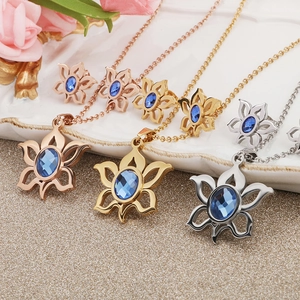 Three-piece hollow sunflower jewelry set with blue gemstones in rose gold, gold, and silver