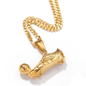 Detailed close-up of golden stainless steel soccer sneaker and ball pendant