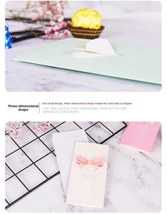 Detailed view of 3D butterfly and heart pop-up holiday cards with elegant envelopes