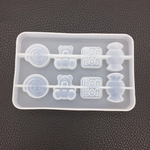 Detailed top view of 8-cavity silicone mold with bear, candy, and bon-bon shapes
