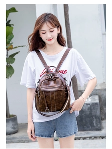 Detailed view of women's vintage brown anti-theft backpack made of premium faux leather