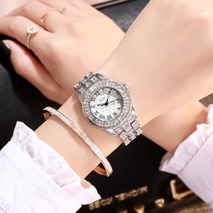 Detail of silver ladies quartz watch with full rhinestone inlay and Roman numerals