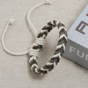 Close-up of handmade woven bracelet with adjustable knot in army green and coffee