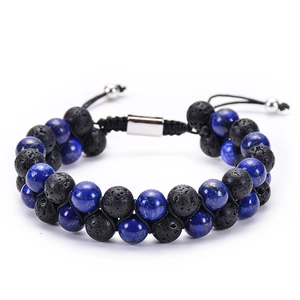 Detail of double-layer men's bracelet with black lava stone and blue lapis lazuli beads
