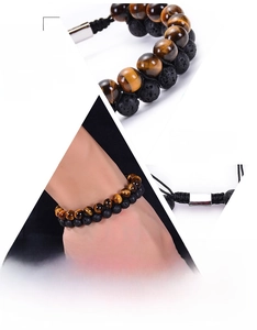 Close-up of double-layer bracelet with natural tiger eye and black volcanic lava beads