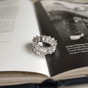 Macro shot of 925 sterling silver ring featuring square-cut clear cubic zirconia stones