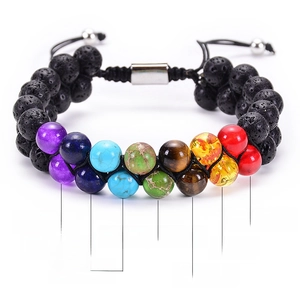 Detail view of double-layer chakra bracelet with natural volcanic stone and colored beads