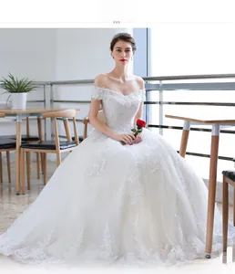 Exquisite off-shoulder wedding gown featuring 3D floral lace embroidery and starry tulle train