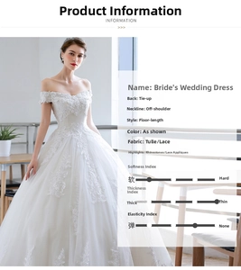 Detail of off-shoulder wedding dress with lace appliques and rhinestone star pattern